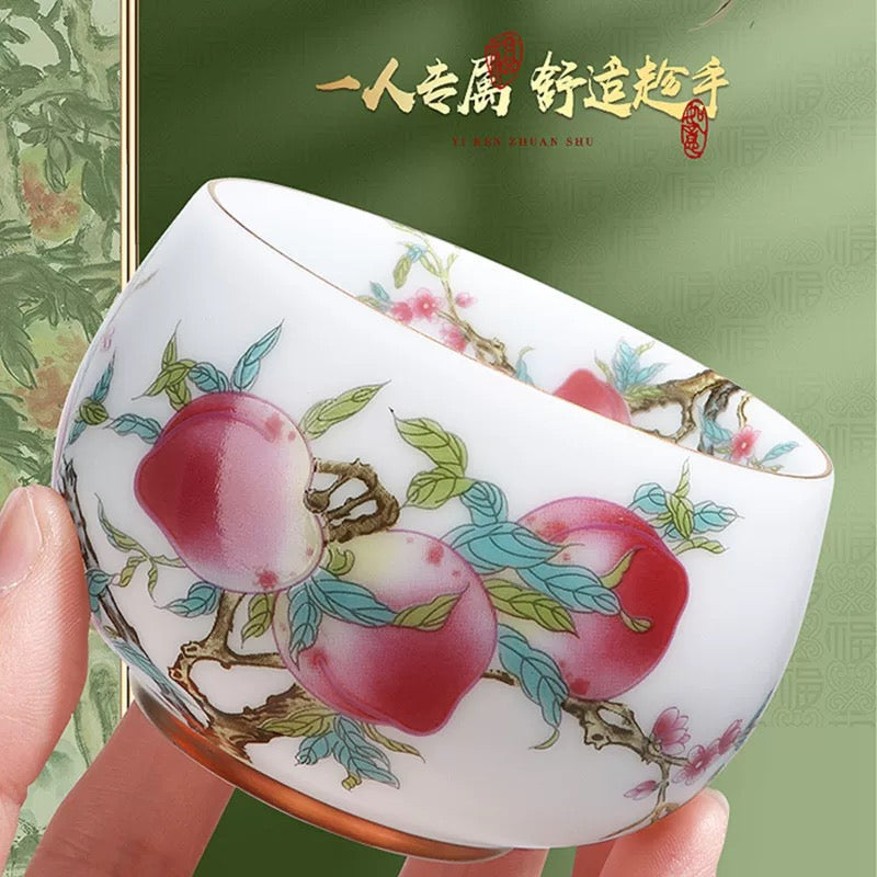 Peach Longevity Icy Jade Porcelain Tea Cup | Lucky Chinese Tea Bowl— Elegant icy jade porcelain tea cup with nine peaches pattern, enhancing tea aroma, symbol of longevity and good fortune for gifting.