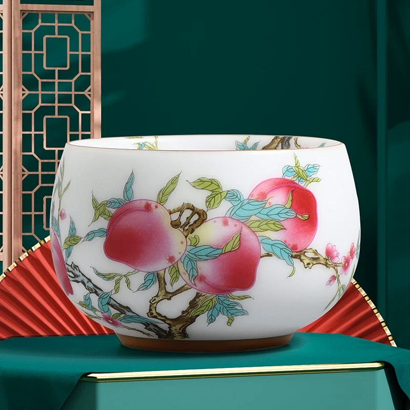 Peach Longevity Icy Jade Porcelain Tea Cup | Lucky Chinese Tea Bowl— Elegant icy jade porcelain tea cup with nine peaches pattern, enhancing tea aroma, symbol of longevity and good fortune for gifting.