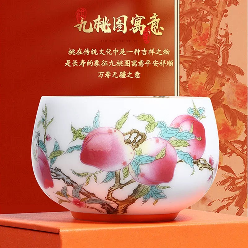 Peach Longevity Icy Jade Porcelain Tea Cup | Lucky Chinese Tea Bowl— Elegant icy jade porcelain tea cup with nine peaches pattern, enhancing tea aroma, symbol of longevity and good fortune for gifting.