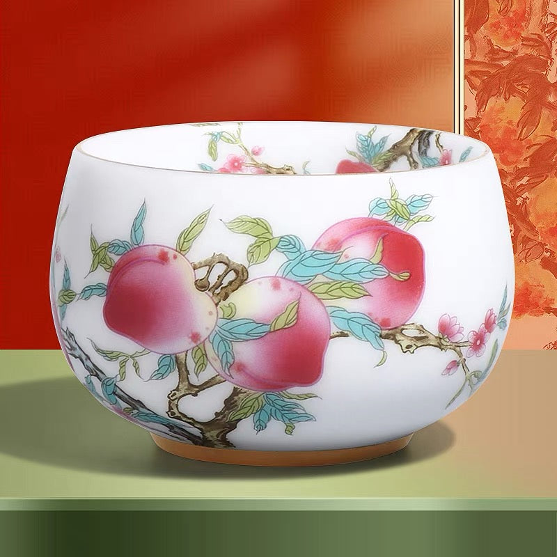 Peach Longevity Icy Jade Porcelain Tea Cup | Lucky Chinese Tea Bowl— Elegant icy jade porcelain tea cup with nine peaches pattern, enhancing tea aroma, symbol of longevity and good fortune for gifting.